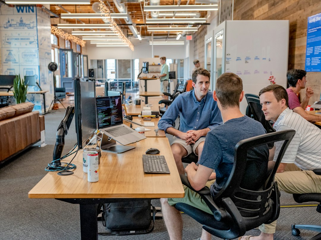 Software team working at computers in a bright office